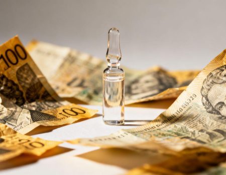 Australian dollars and a vial