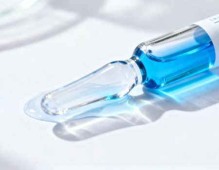 Vial of blue GHK-Cu peptide solution.