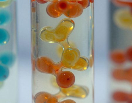Abstract swirling liquid peptides in vibrant colors.